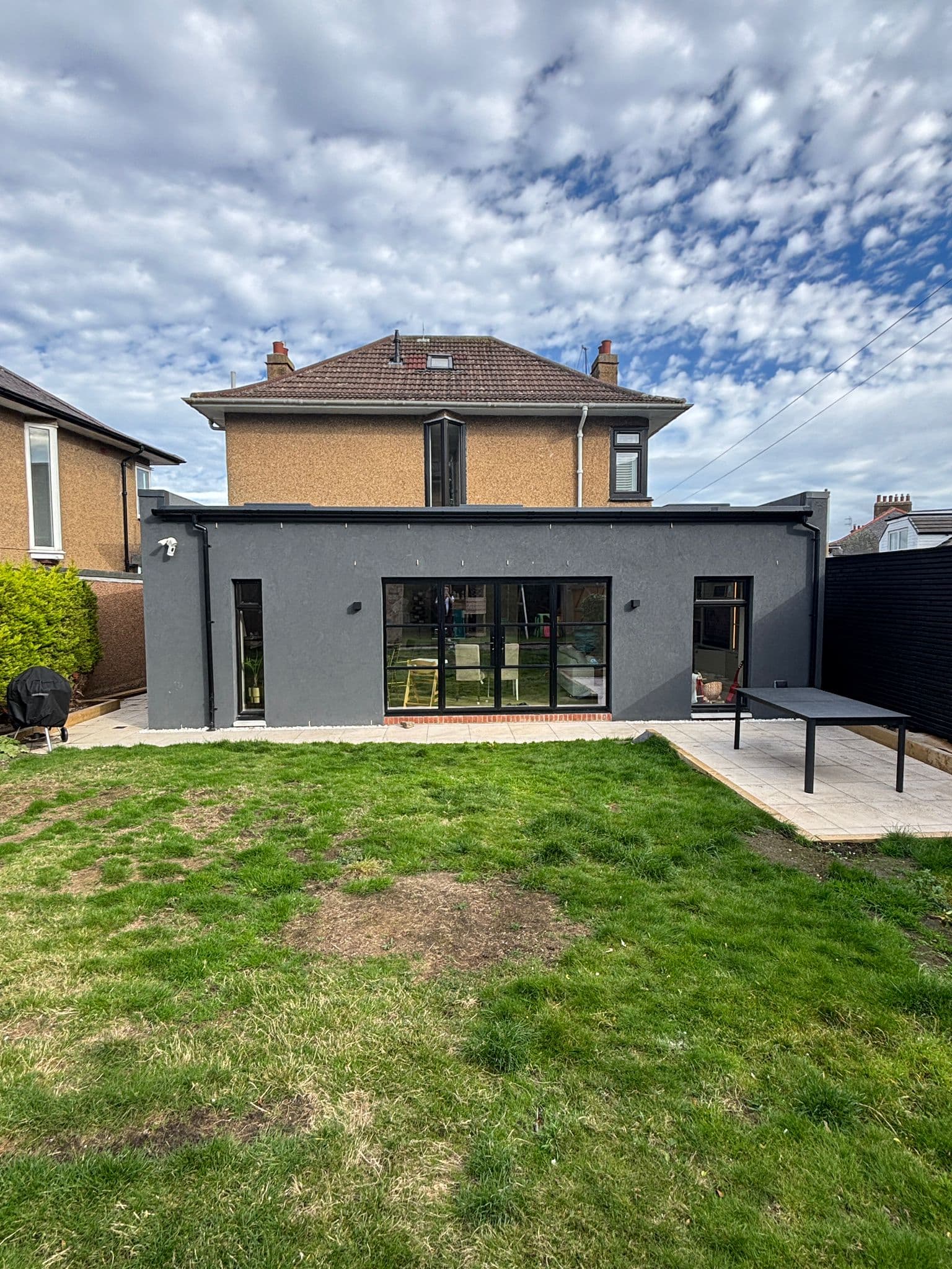Traditional sandstone villa with seamless modern rear extension